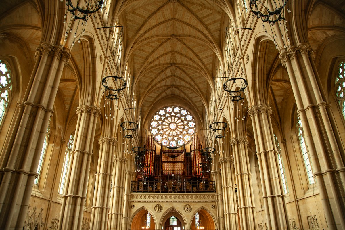 Interior of a gothic cathedral with a rose window