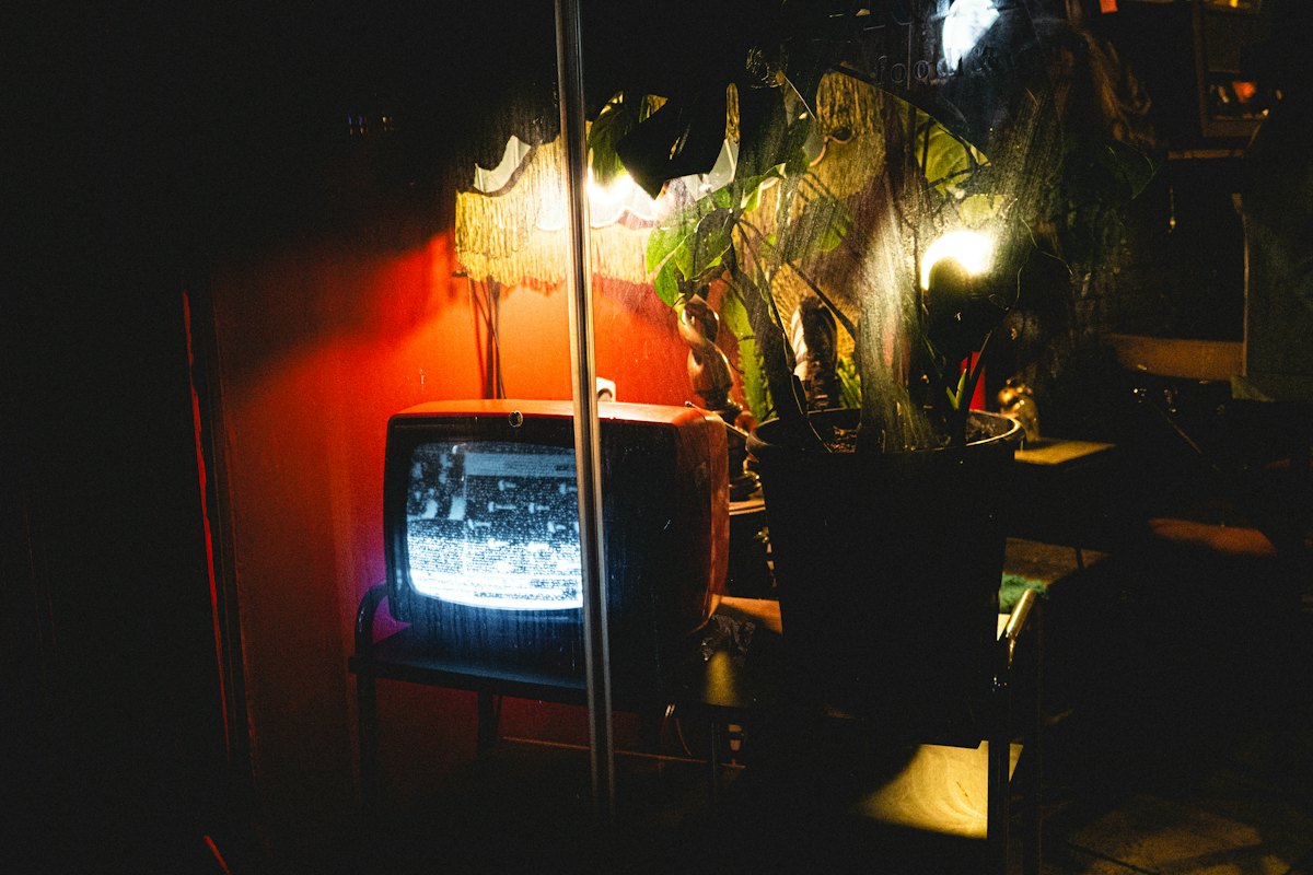 An old television glowing at night